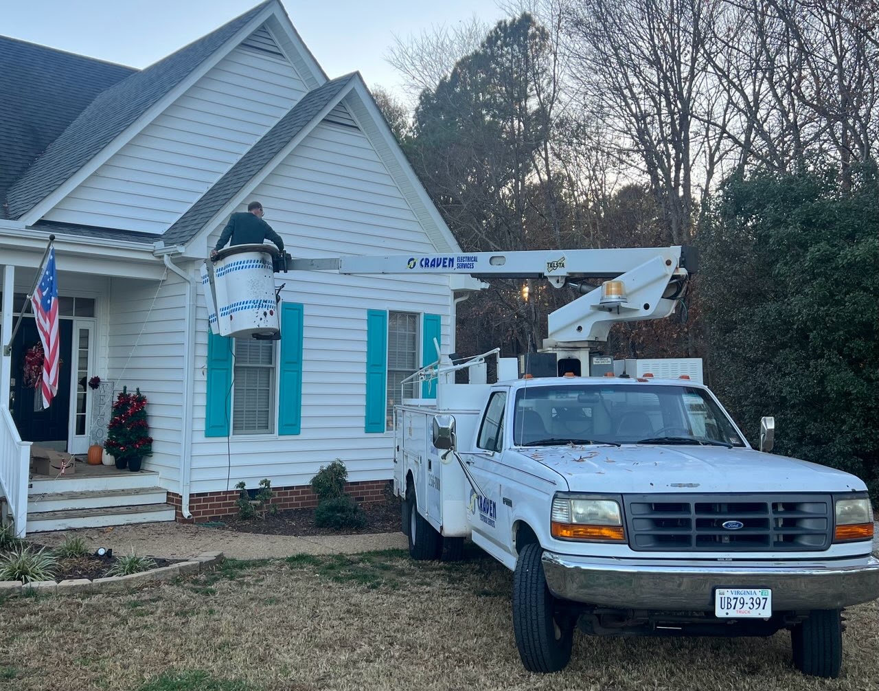 Craven Electrical bucket truck installing christmas lights on a home in central Virginia